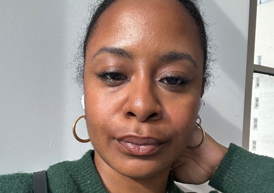 Woman wears the espresso makeup trend against a white background