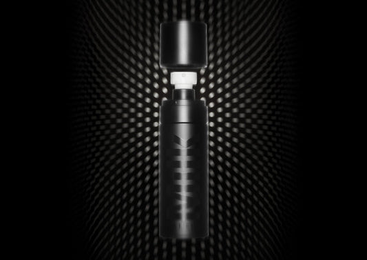 Bottle of Milk Makeup Pore Eclipse Matte Setting Spray against a black background with dots.