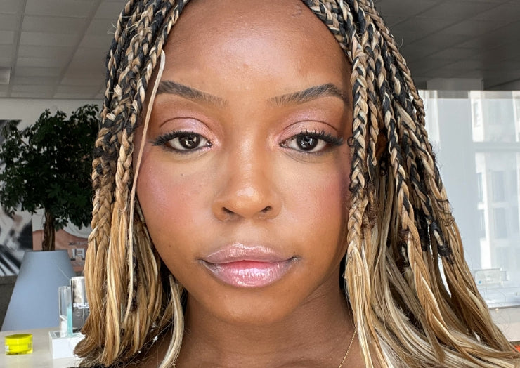 Woman wears a Y2K-inspired pink makeup look with Milk Makeup Odyssey Lip oil Gloss in Soul Search.