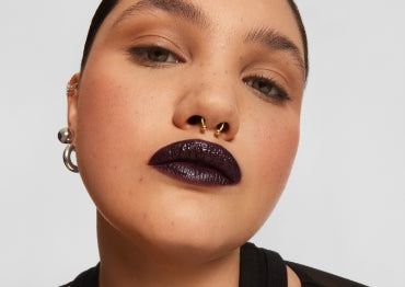 Model wears a full face of Milk Makeup products set with Pore Eclipse Matte Translucent Setting Powder on a white background