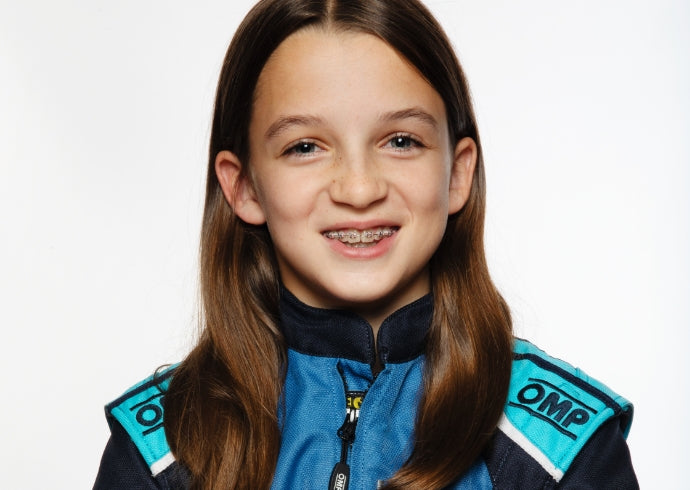 Portrait of Maggie Webster in her karting suit