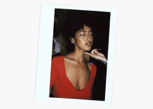 On-set polaroid of Milk Makeup model Malak Idrissi